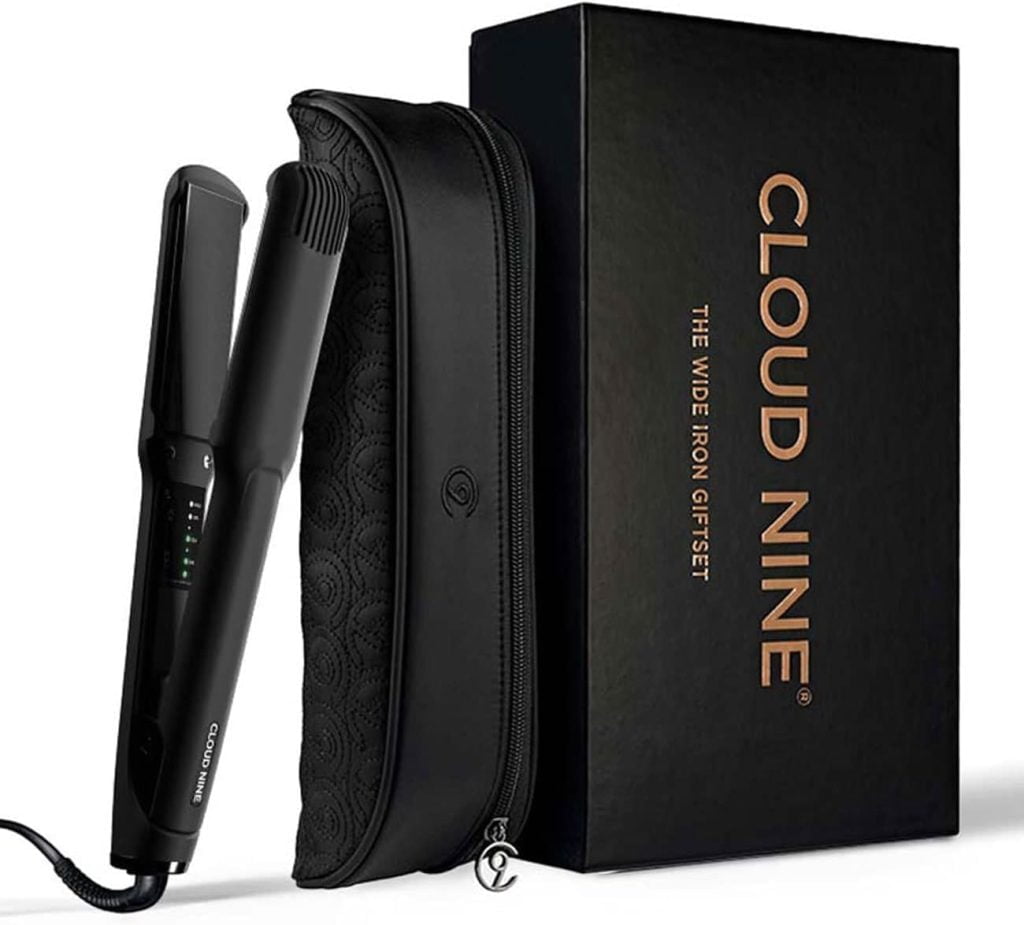 A "Cloud Nine" flat iron placed on its pouch and displayed with packaging.