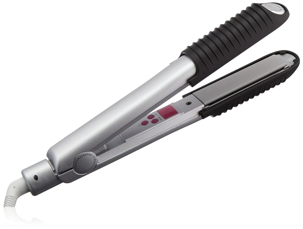 A silver and black hair straightening brush with bristles.