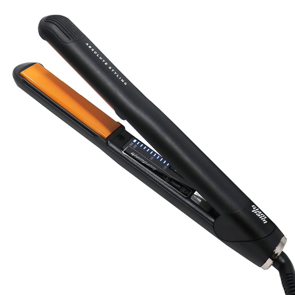 A black flat iron with orange heating plates.