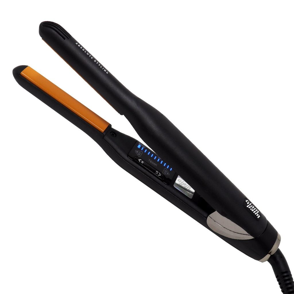 A black flat iron with orange heating plates on a white background.
