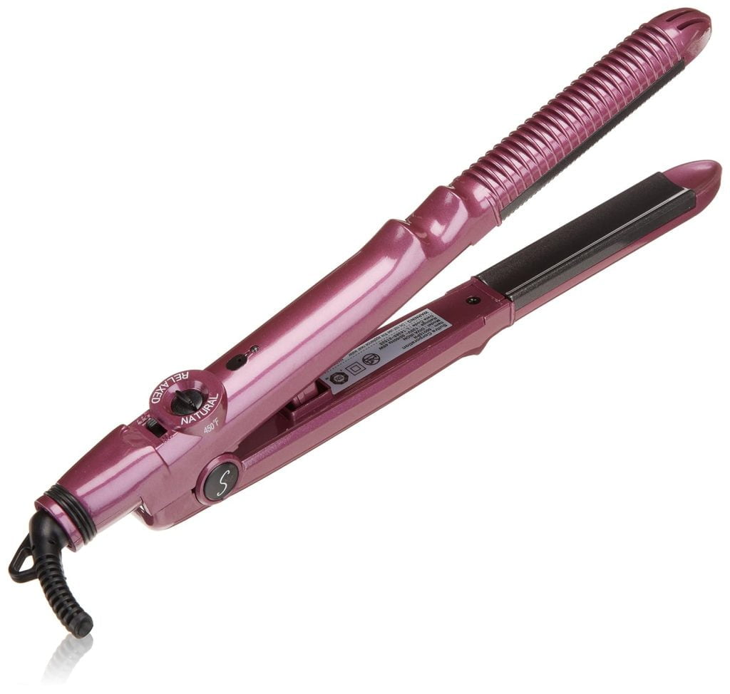 A pink curling and straightening iron with a ribbed design.